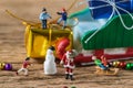 Miniature figure Santa claus with happy children running and sta