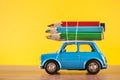 Creative Journey: Miniature Car Carrying Colored Pencils for Education and Art