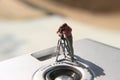 miniature figure of a videographer recording