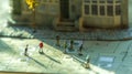 Miniature Figures Walking on a City Map Layout with Building Background Royalty Free Stock Photo