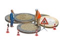 Miniature figures working on a heap of Euro coins. Royalty Free Stock Photo