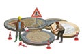 Miniature figures working on a heap of Euro coins. Royalty Free Stock Photo