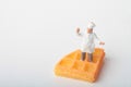 Miniature figurine of a chef with a giant waffle