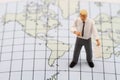 Miniature figurine of a geography teacher Royalty Free Stock Photo