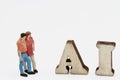 miniature figurine of people with artificial intelligence abbreviation Royalty Free Stock Photo