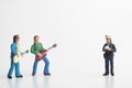 Miniature figurine of a policewoman making a fine to a couple of musicians