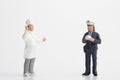 Miniature figurine of a policewoman officer making a fine to a cook