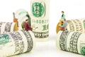 Miniature figurines discussion on the edge of us dollar banknote Royalty Free Stock Photo