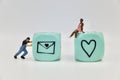 miniature figurines of a lover sending a love letter to his girlfriend