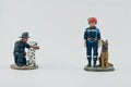 Miniature of firemen and their dogs Royalty Free Stock Photo