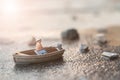 Miniature fishermen are fishing by boat Royalty Free Stock Photo