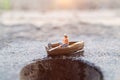 Miniature fishermen are fishing by boat Royalty Free Stock Photo