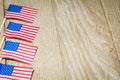 Miniature flags on wooden board Royalty Free Stock Photo