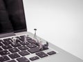 Team Of Miniature Forensics Experts Examining Laptop Keyboard 