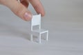 Miniature furniture made of cardboard, painted white. Doll table with chair scale 1:24