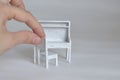 Miniature furniture made of cardboard, painted white Royalty Free Stock Photo