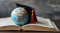 Miniature globe with a graduation cap on top, placed on an open book.. AI generated Royalty Free Stock Photo