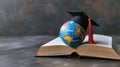 Miniature globe with a graduation cap on top, placed on an open book.. AI generated Royalty Free Stock Photo