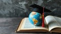 Miniature globe with a graduation cap on top, placed on an open book.. AI generated Royalty Free Stock Photo