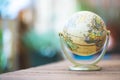 Miniature globe model on a rustic wooden table. Symbol for travelling Royalty Free Stock Photo