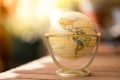 Miniature globe model on a rustic wooden table. Symbol for travelling Royalty Free Stock Photo