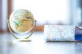 Miniature globe model on a rustic wooden table. Symbol for travelling Royalty Free Stock Photo