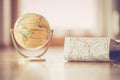 Miniature globe model on a rustic wooden table. Symbol for travelling Royalty Free Stock Photo