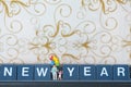 Miniature group happy family holding balloons with new year Royalty Free Stock Photo