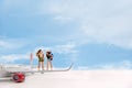 Miniature Group hiker and traveler with backpack standing on the airplane blue sky background