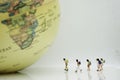 Miniature Group of Student walking to the big world use as new technology social network , study aboard and education concept