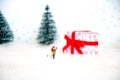 Miniature happy lover couple with background christmas tree, red gift`s box ,merry chistmas and happy new year concept