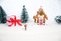 Miniature happy lover couple with background christmas tree, red gift`s box ,merry chistmas and happy new year concept