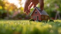 The miniature house in hand.AI generated image Royalty Free Stock Photo