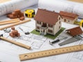 Miniature house model on architectural plans Royalty Free Stock Photo