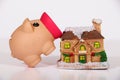 Miniature house model with piggy bank. Royalty Free Stock Photo