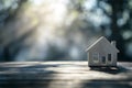 Miniature House Model with Shadow - Real Estate Concept on Gray Background Royalty Free Stock Photo