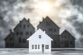 Miniature House Model with Shadow - Real Estate Concept on Gray Background Royalty Free Stock Photo