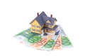 Miniature house over euro money isolated Royalty Free Stock Photo