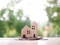 Miniature house on stack of coins. The concept of saving money for house, Property investment, House mortgage, Real estste Royalty Free Stock Photo