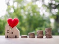 Miniature house and stack of coins. The concept of saving money for house, Property investment, House mortgage, Real estste Royalty Free Stock Photo