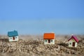 Miniature house on tropical sand beach . property real estate Royalty Free Stock Photo