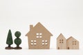 Miniature houses and trees on white background. Royalty Free Stock Photo