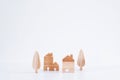 Miniature houses and trees on white background. Wooden House Model. Royalty Free Stock Photo