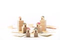 Miniature houses on wooden cubes and some euro and dollar bills Royalty Free Stock Photo