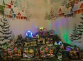 Miniature illuminated christmas village at santa claus shop in Terni