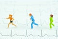 Miniature joggers run on cardiogram