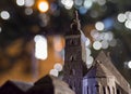 A miniature of Krakow`s market and the St. Mary`s Basilica. There is bokeh behind it
