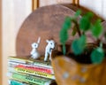 Miniature lamb figurine on a bookshelf