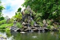 Asian miniature landscape of bizzare rock formation and waterfall in Thien Mu Pagoda garden, City of Hue, Vietnam Royalty Free Stock Photo