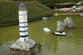 Miniature lighthouse at the park Mini Europe. Royalty Free Stock Photo